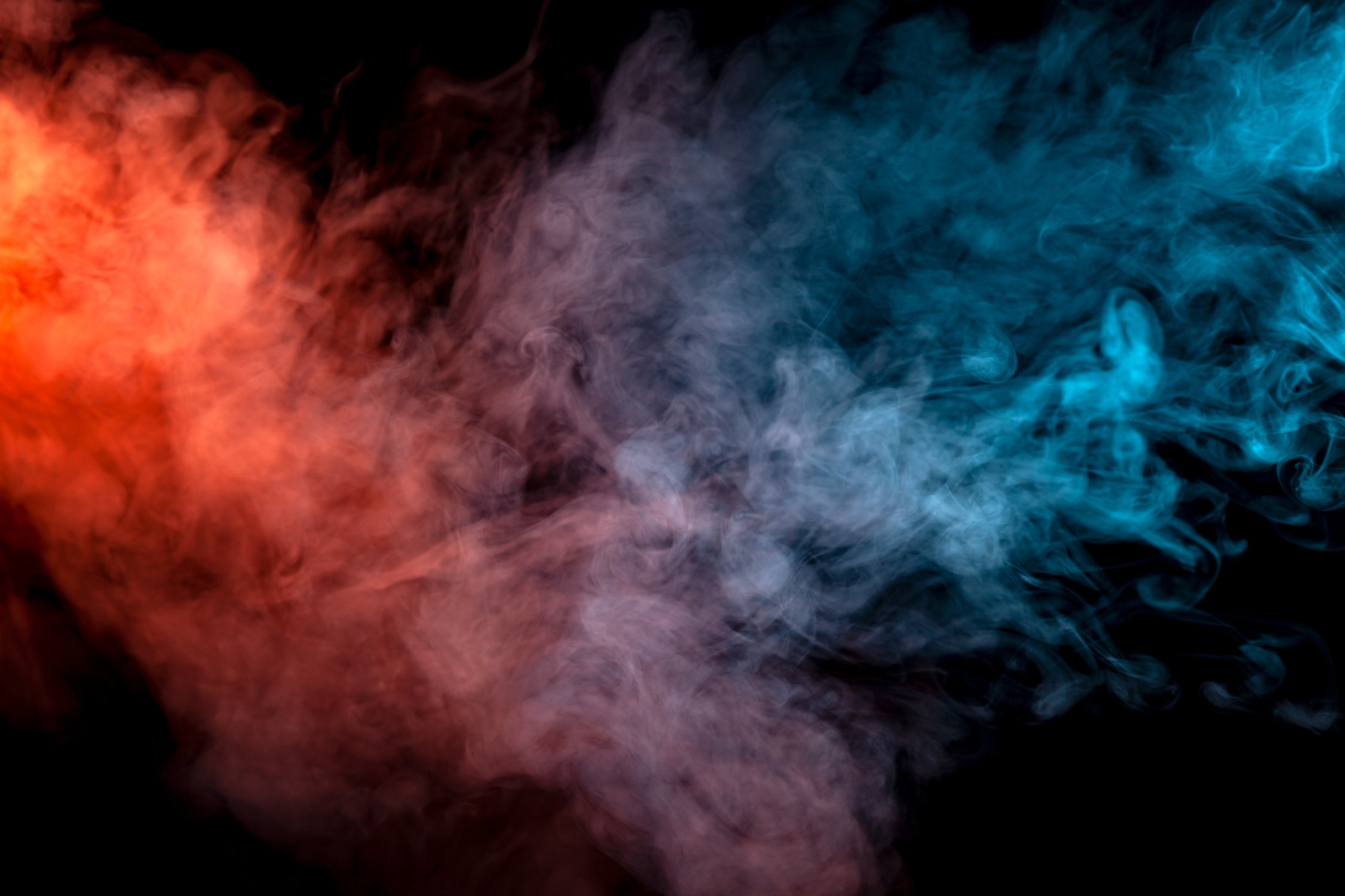 Orange and Blue Smoke on Black Background 